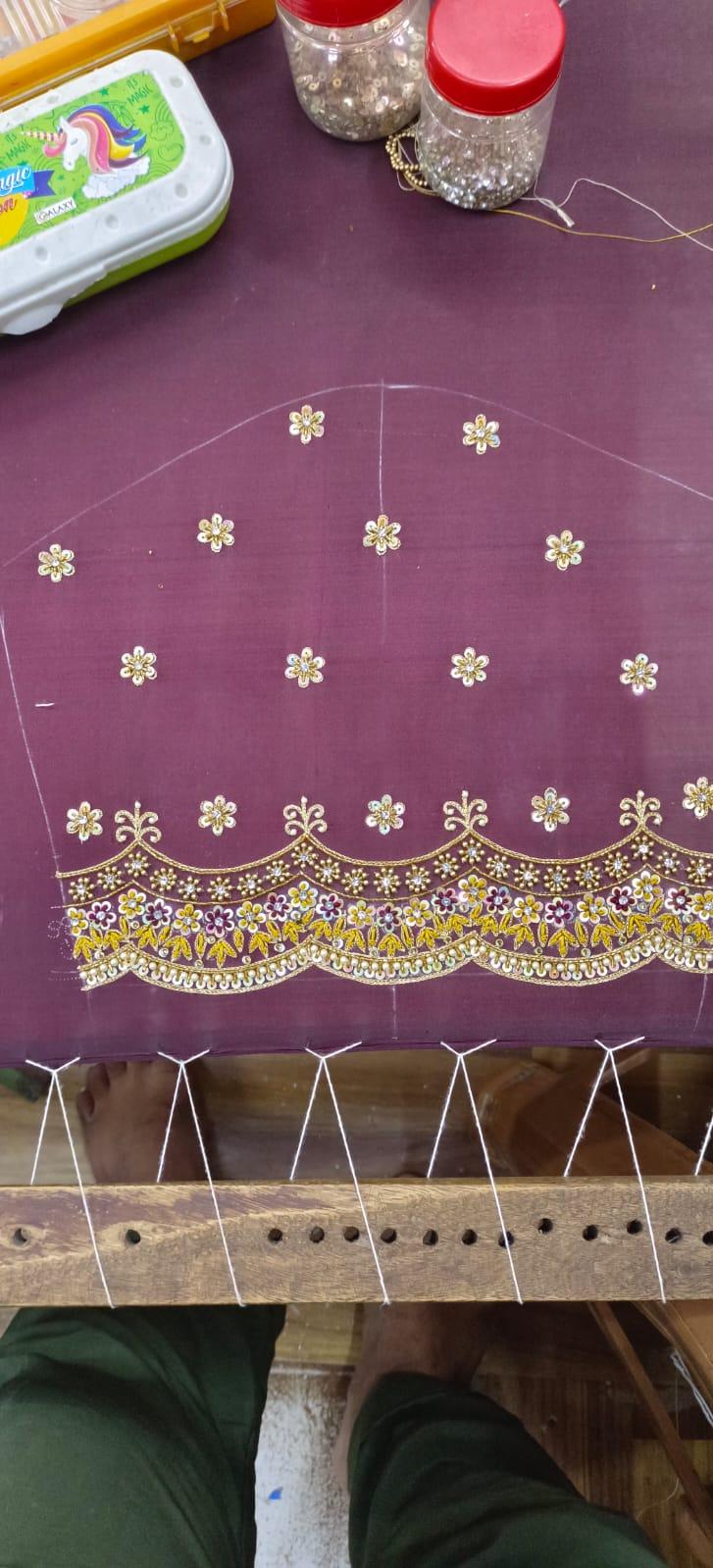 Purple saree with gold floral zari embroidery and scalloped border design