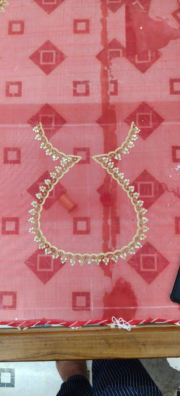 Pink silk saree with geometric pattern and gold zari neckline embroidery