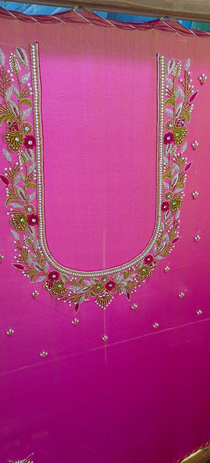 Magenta blouse with gold zari and floral maggam work neckline