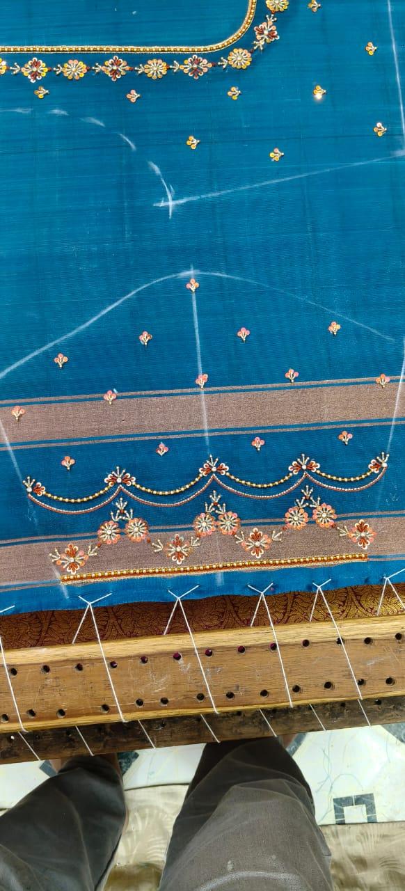 Blue silk saree with gold zari and maggam work embroidery