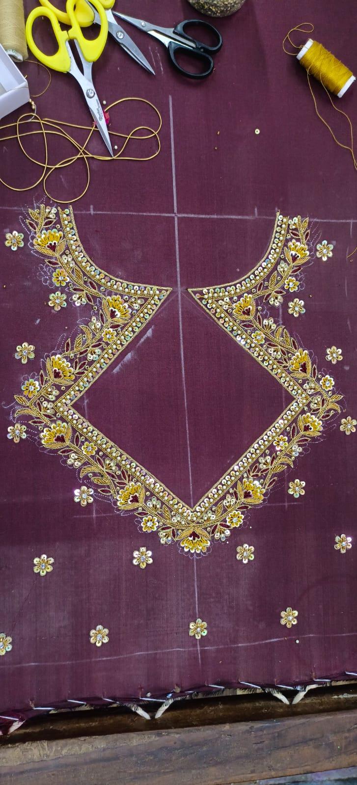 Purple silk blouse with gold zari floral maggam embroidery work