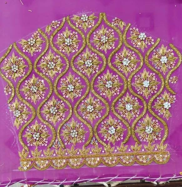 Purple blouse with dense gold floral maggam work and pearl embellishments