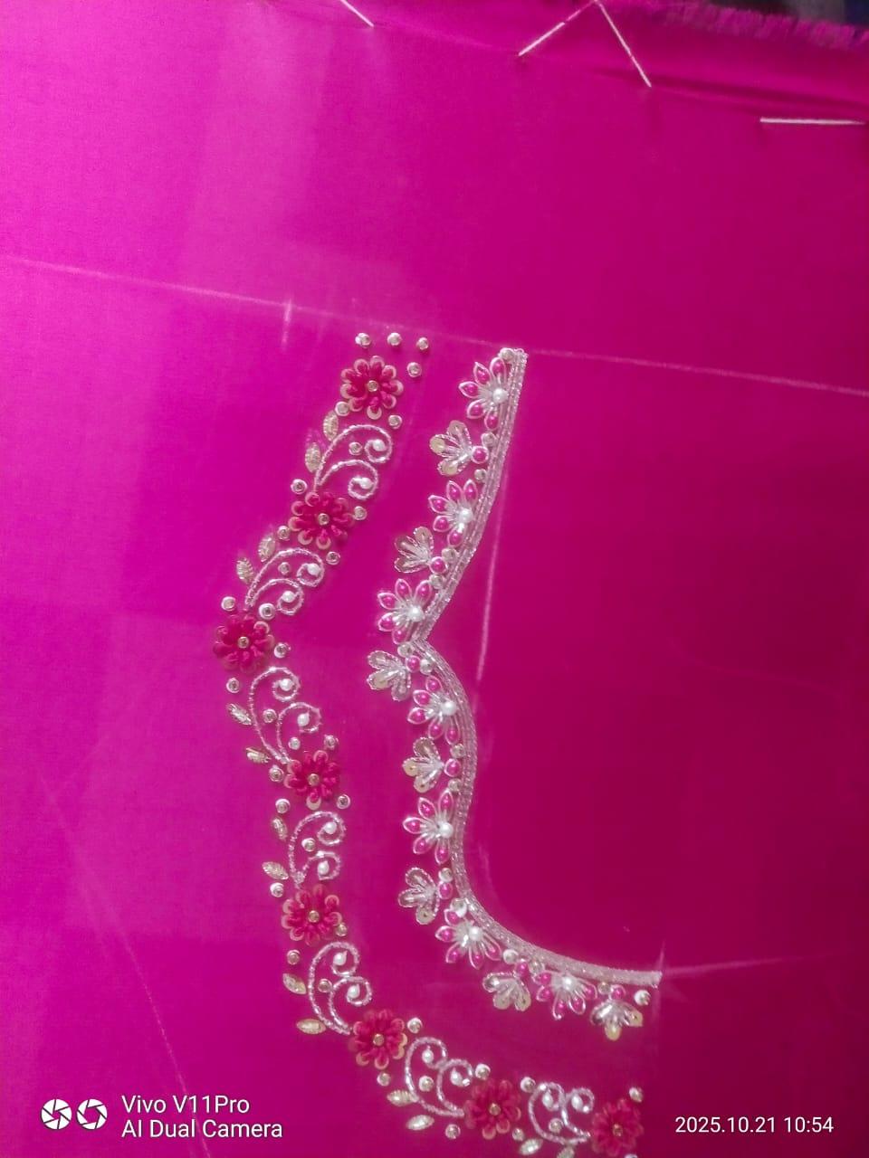 Hot pink blouse with ornate gold zari floral embroidery and beadwork