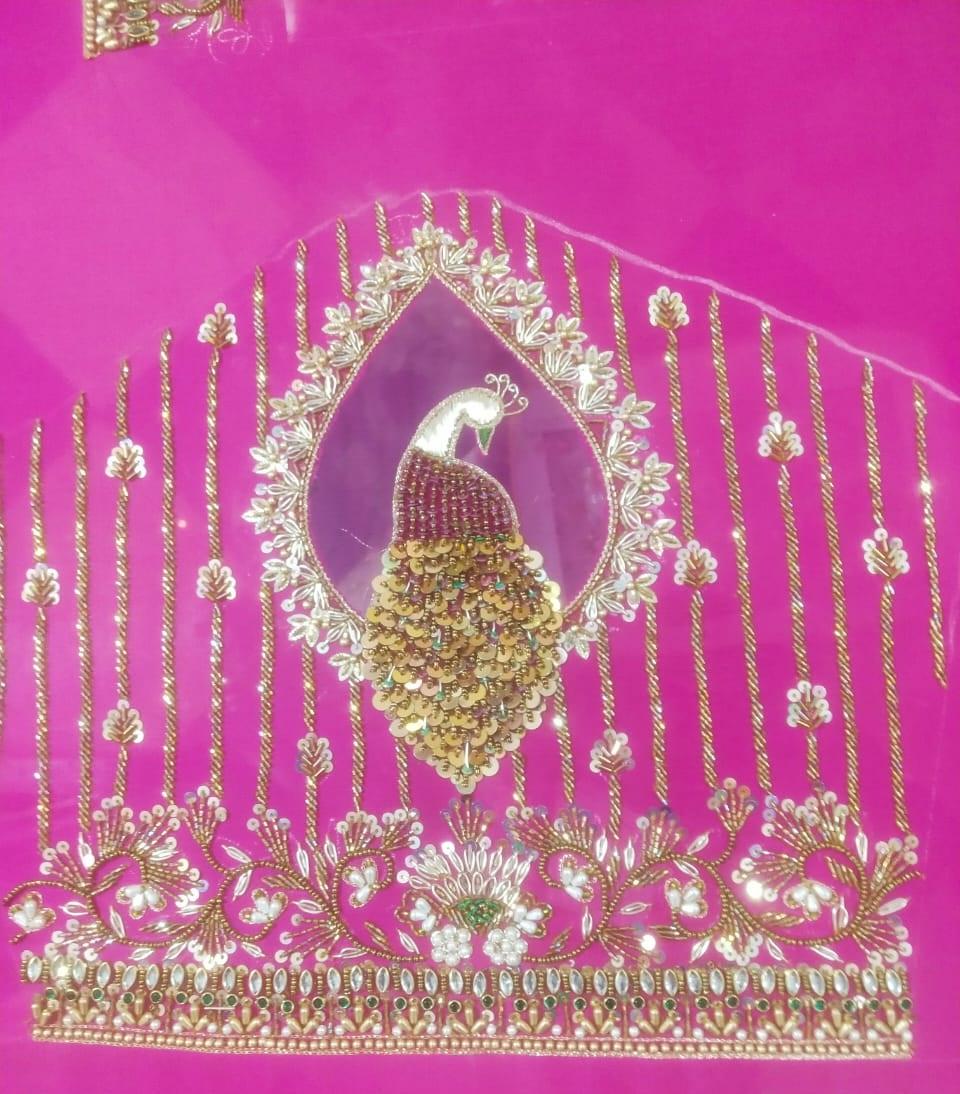 Magenta blouse with gold peacock maggam work and floral embroidery