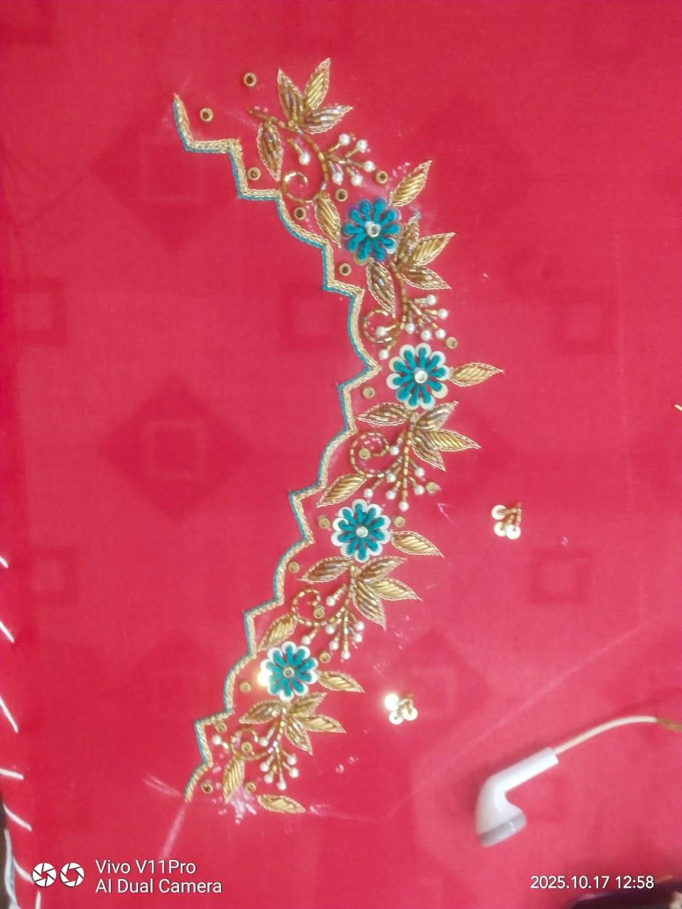 Hot pink fabric with gold zari floral embroidery and turquoise accents