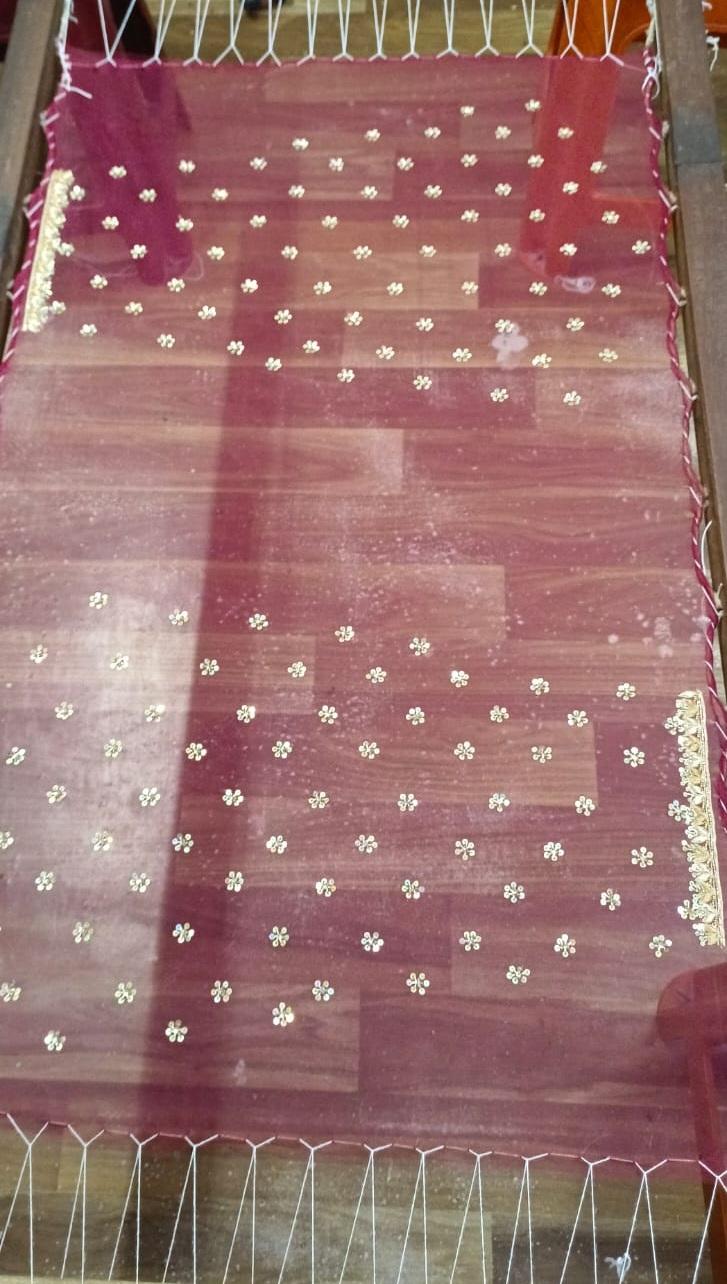 Maroon silk saree with gold floral zari embroidery throughout