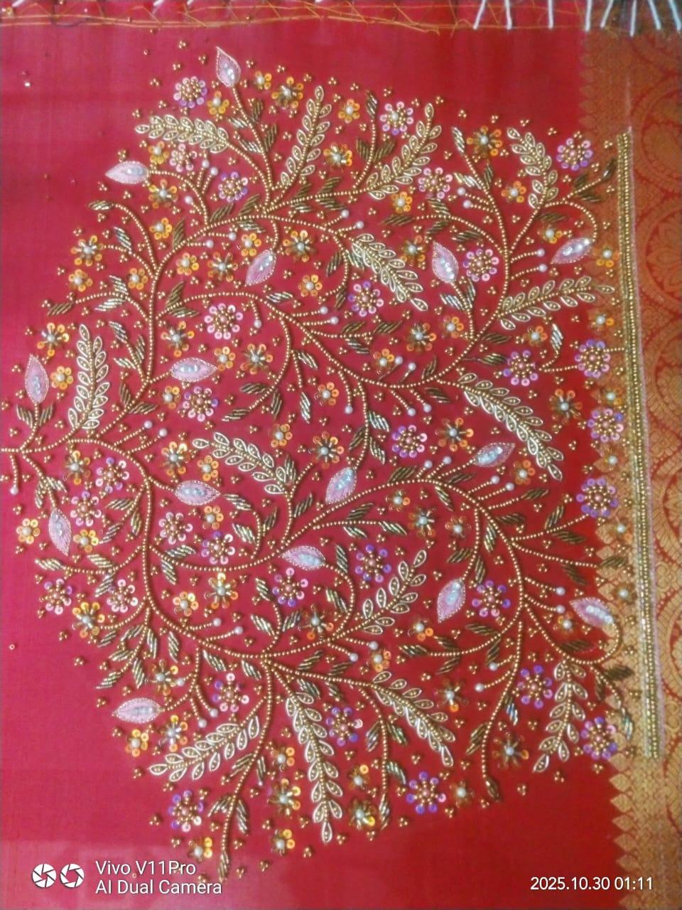 Red silk saree with intricate zari and floral embroidery work