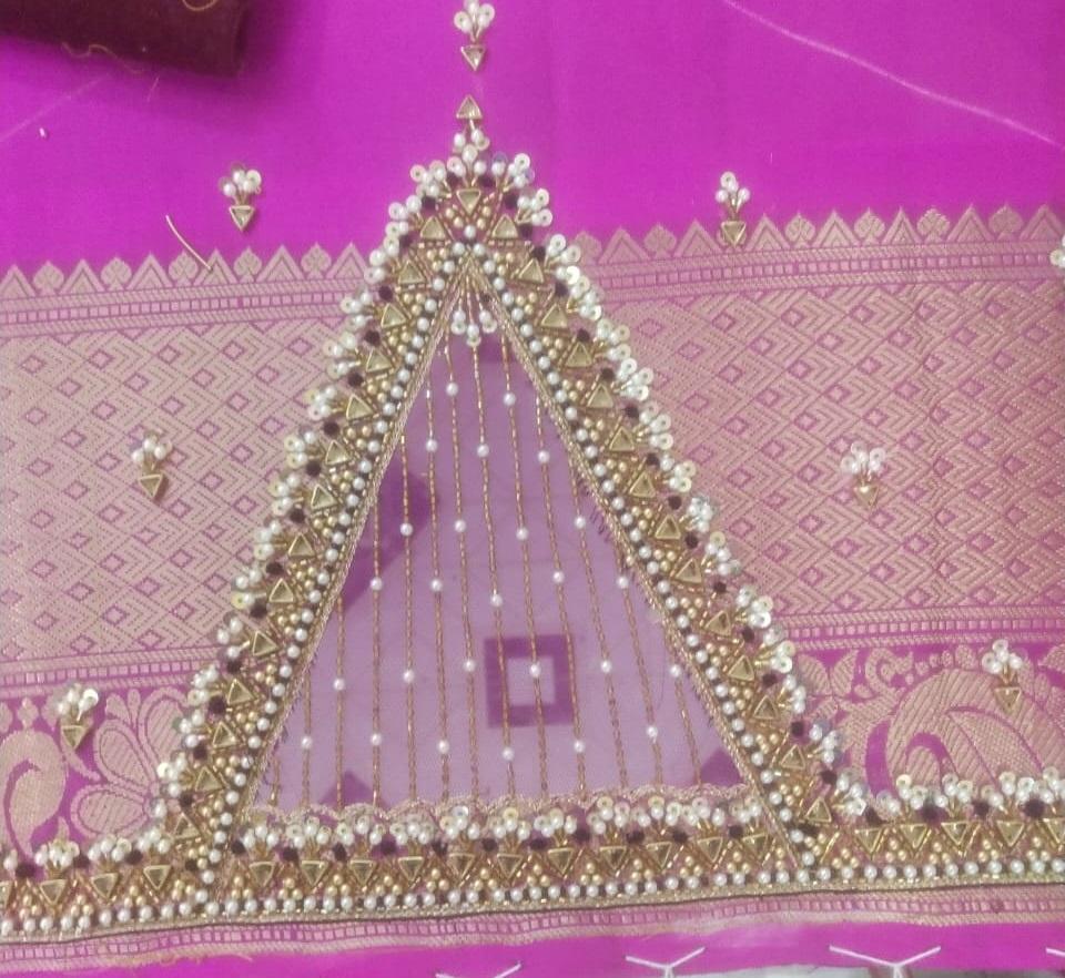 Pink silk saree with gold zari and pearl triangular maggam work border