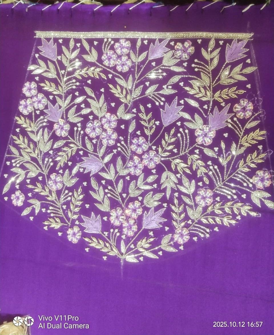 Purple saree with gold and silver zari floral embroidery and decorative border
