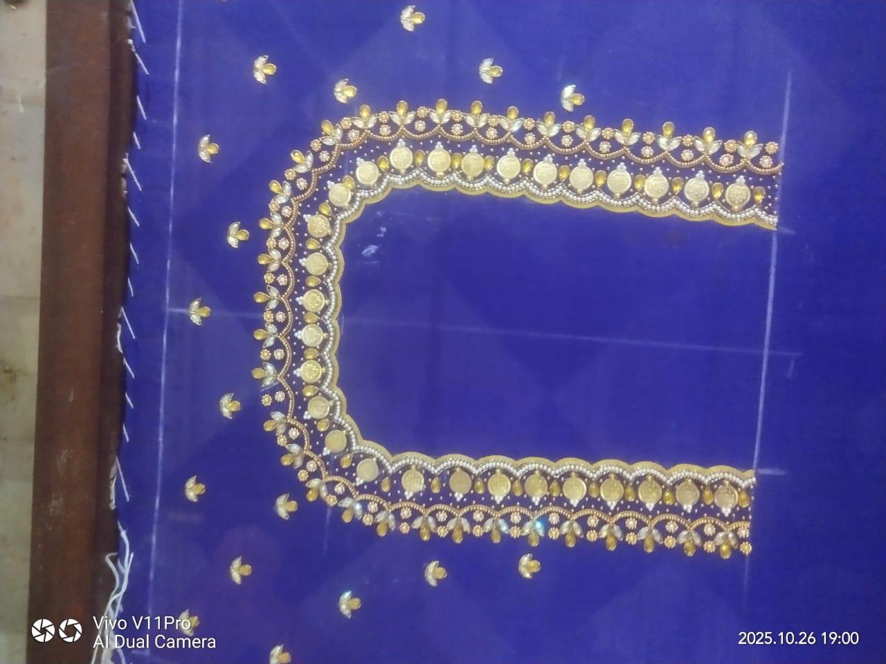 Royal blue fabric with gold zari embroidered decorative border frame