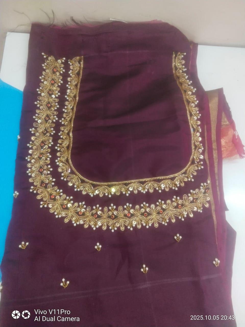 Maroon blouse with gold zari embroidery and pearl detailing