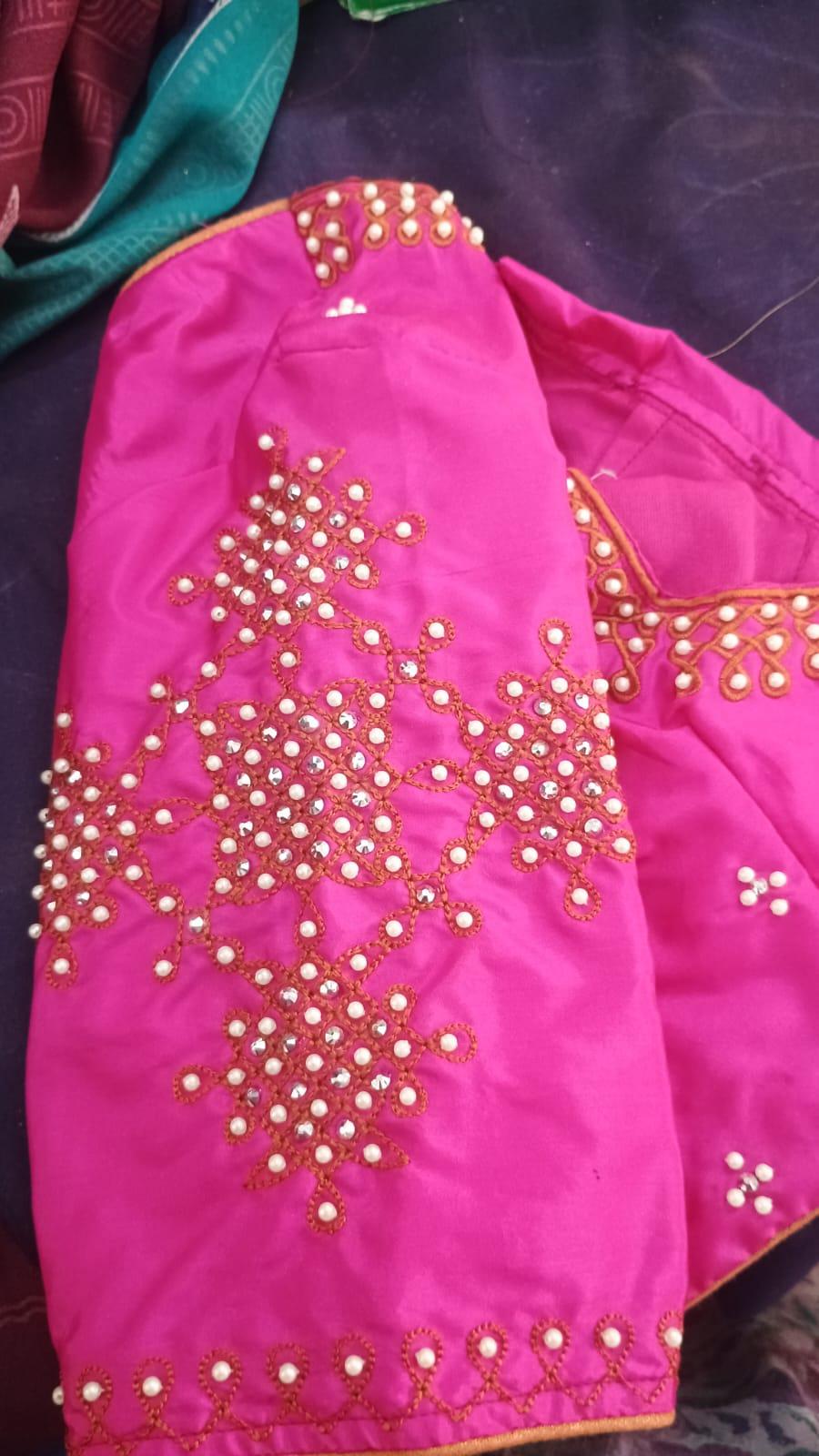 Bright pink blouse with pearl and crystal maggam work embroidery