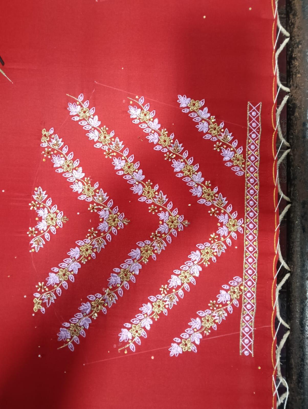Red saree with golden floral zari embroidery and decorative border