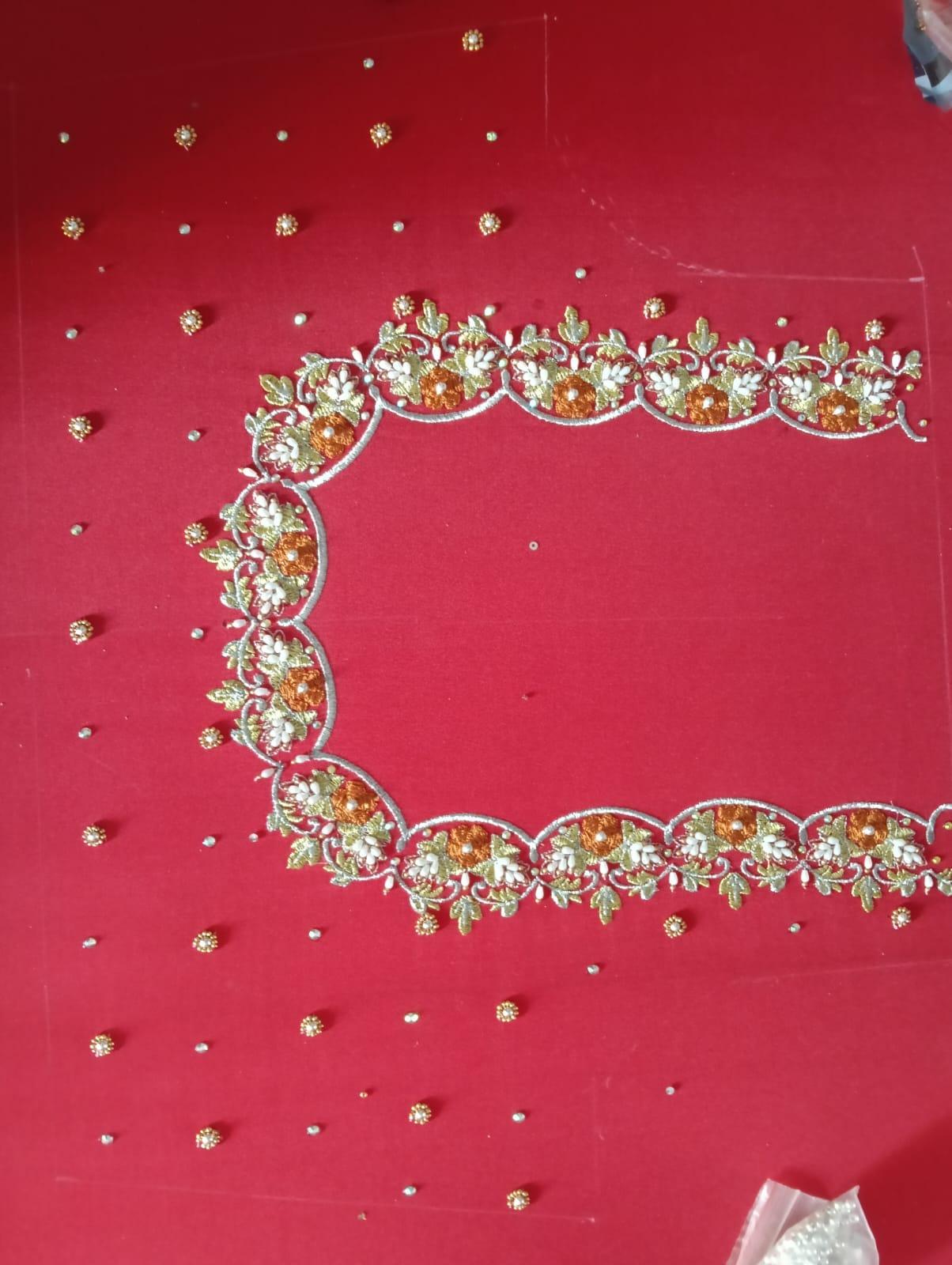 Red saree with gold zari floral embroidered border and scattered sequins
