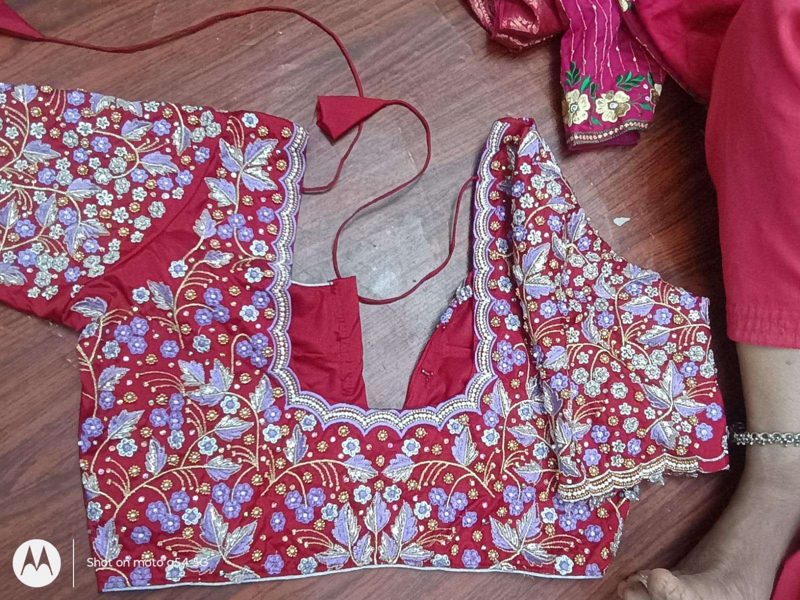 Red bridal blouse with floral maggam work and gold embroidery