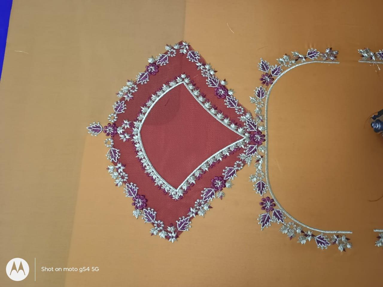 Maroon blouse with ornate silver and purple floral embroidery border