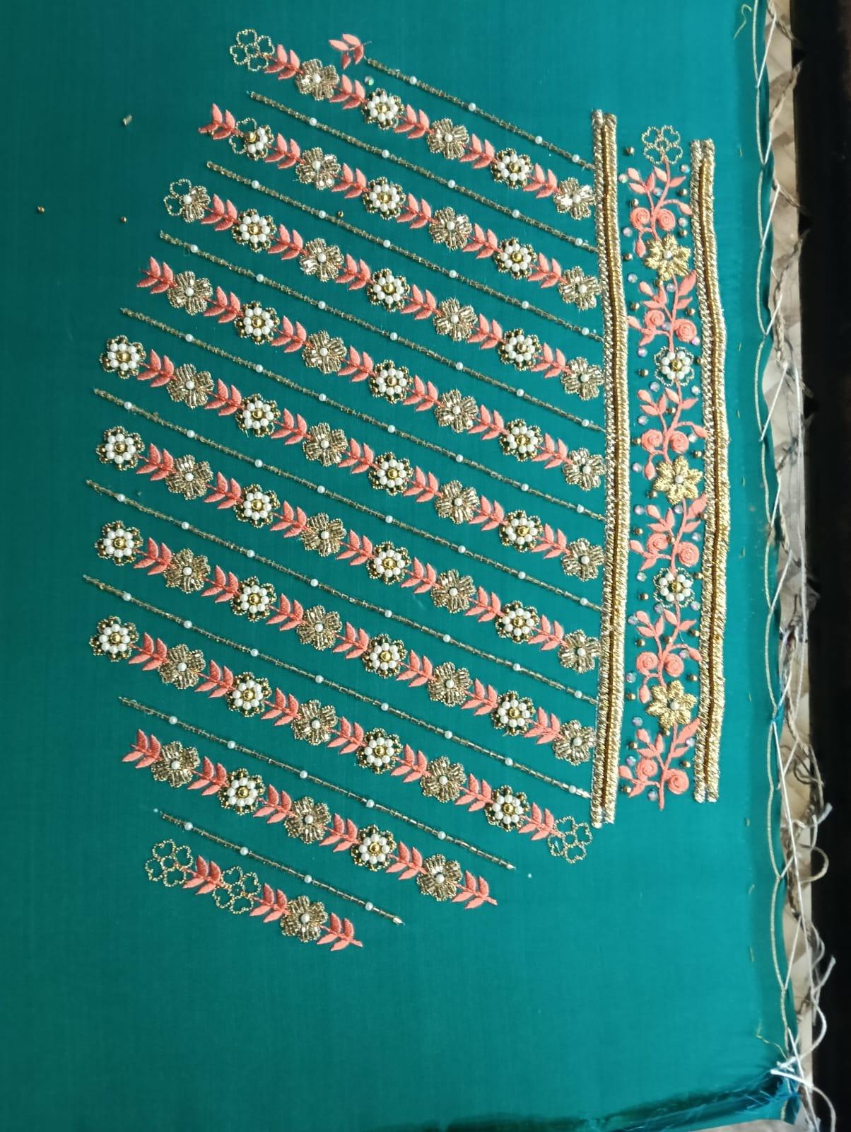 Turquoise saree with gold zari floral striped embroidery and decorative border