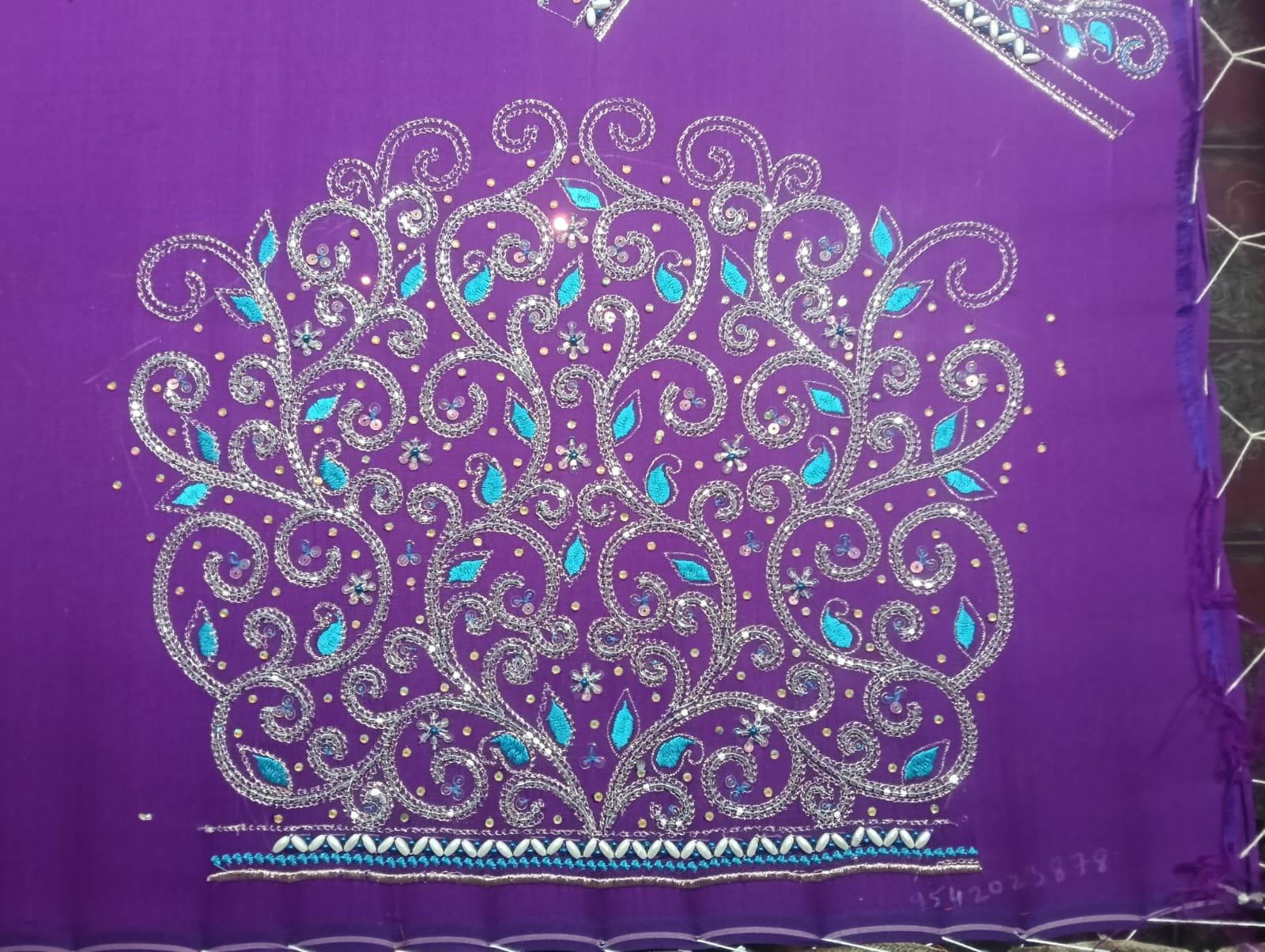 Purple saree with silver zari and turquoise stone embroidery work