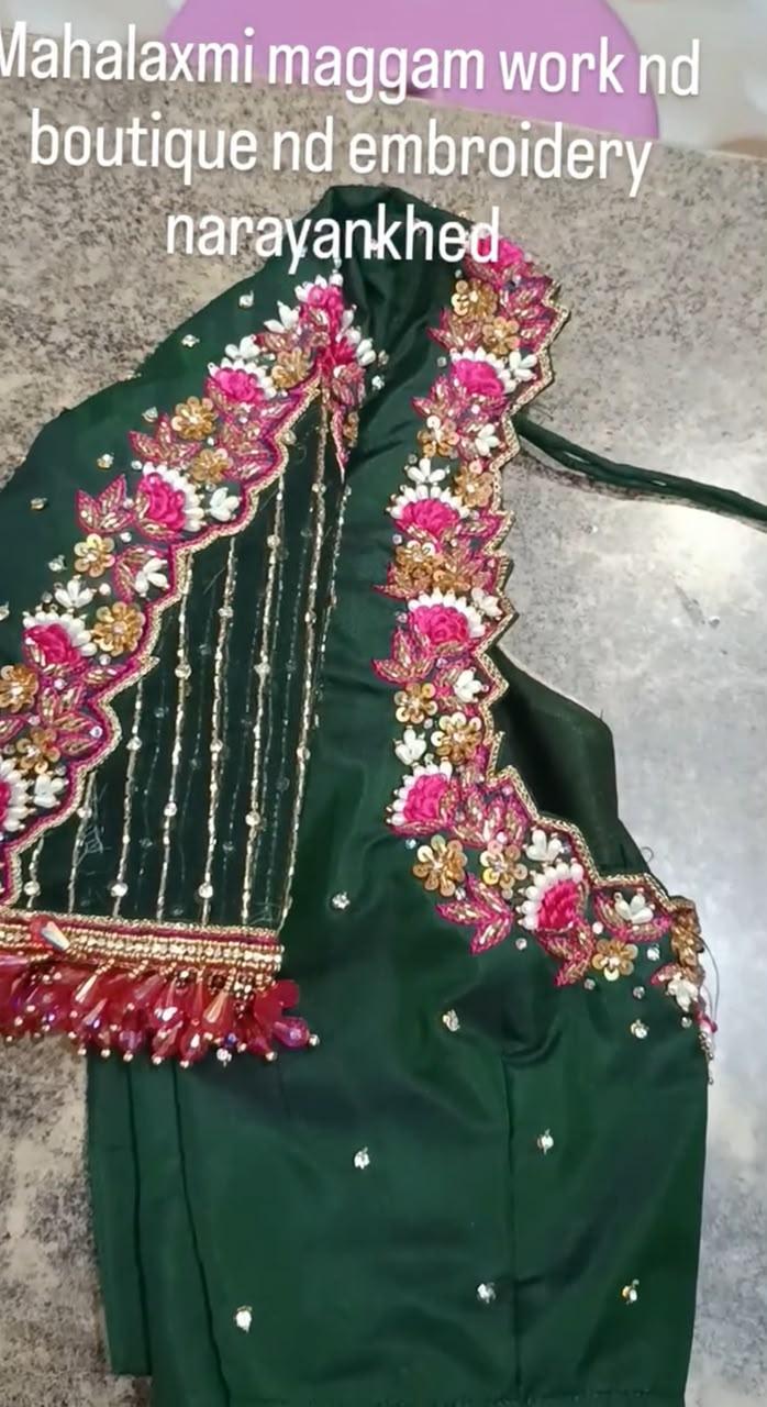 Green designer blouse with vibrant floral maggam work and beaded tassels