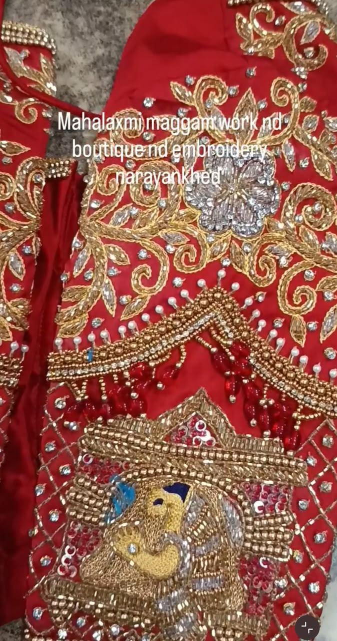 Red bridal blouse with ornate maggam work and pearl embellishments