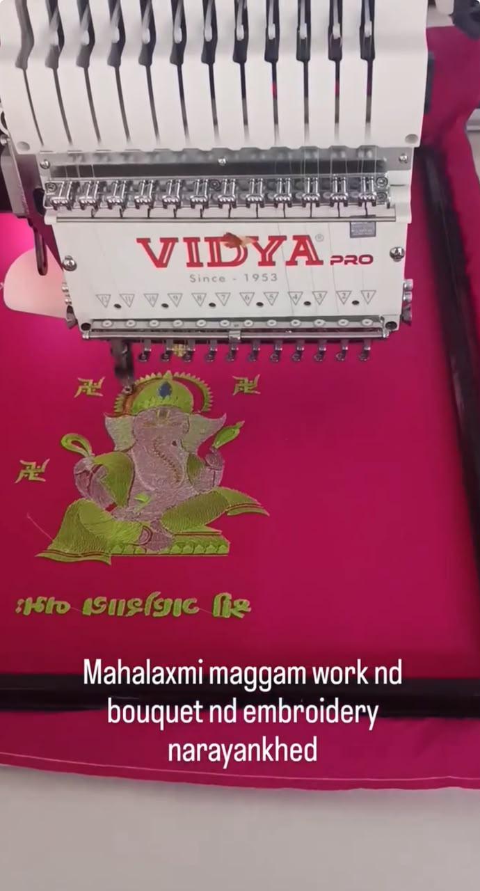 Magenta blouse with maggam work and embroidered bouquet design