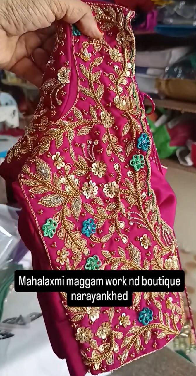 Magenta maggam work blouse with gold floral embroidery and turquoise accents