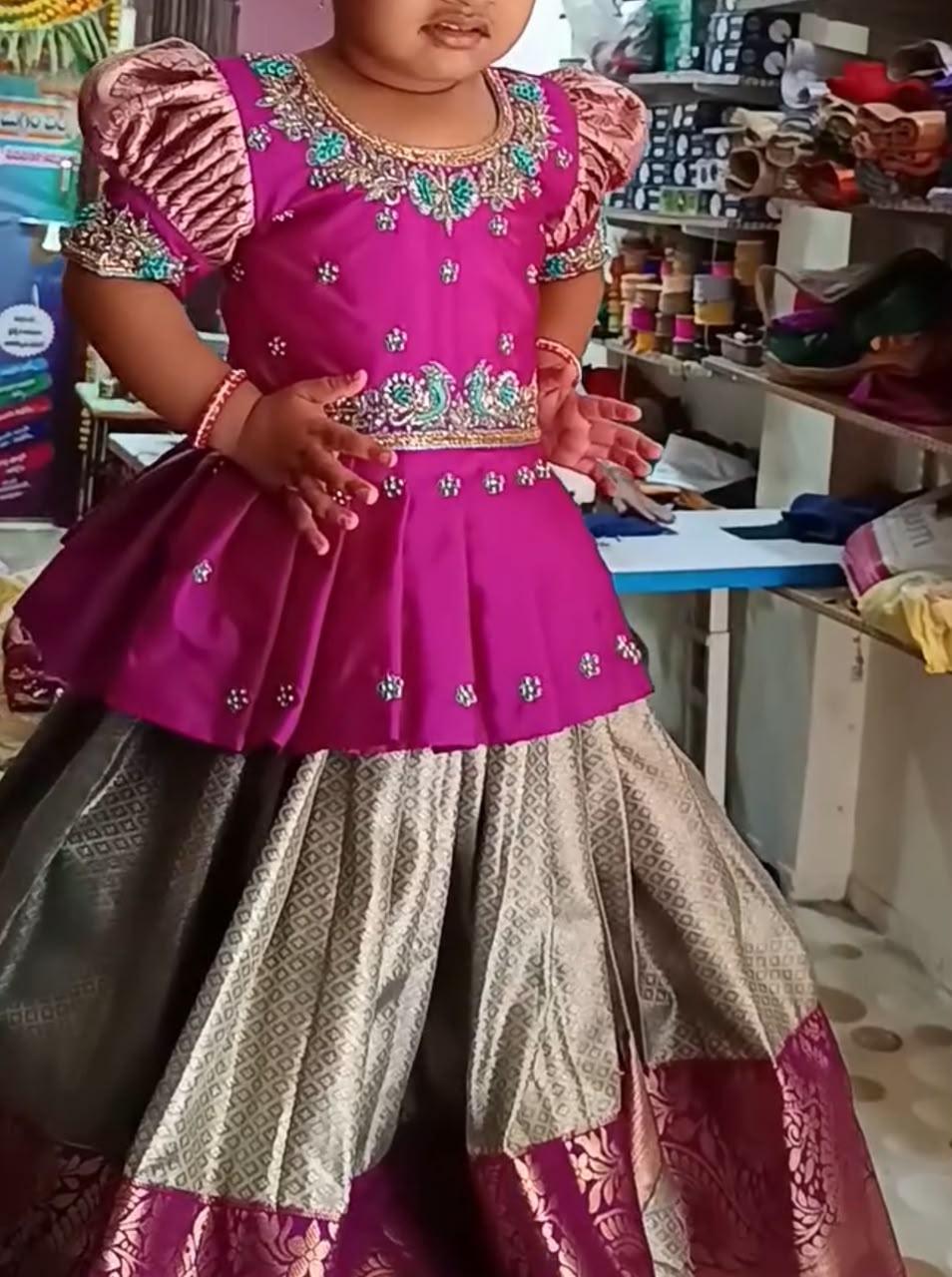 Magenta half saree with embroidered blouse and patterned skirt