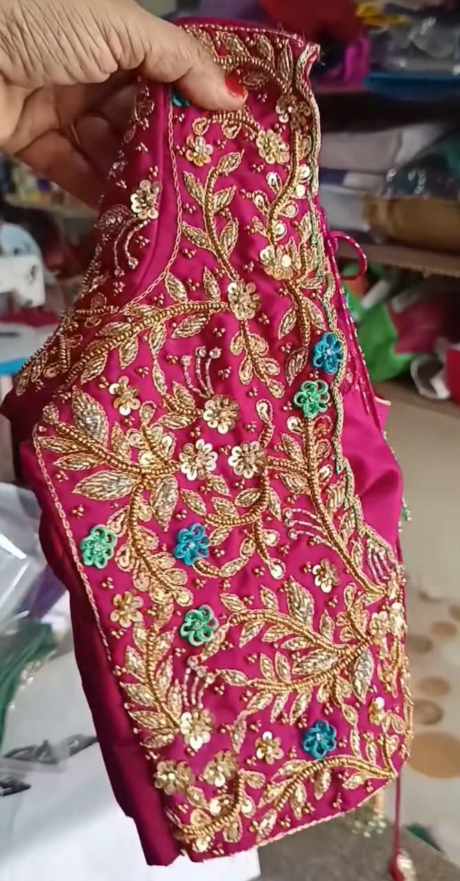 Maroon bridal blouse with gold zari and stone embroidery work