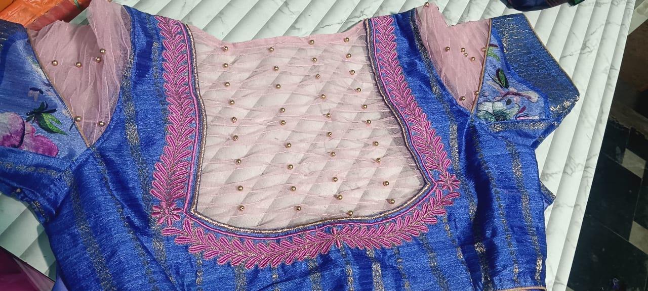 Blue silk blouse with pink pearled neckline and maggam embroidery