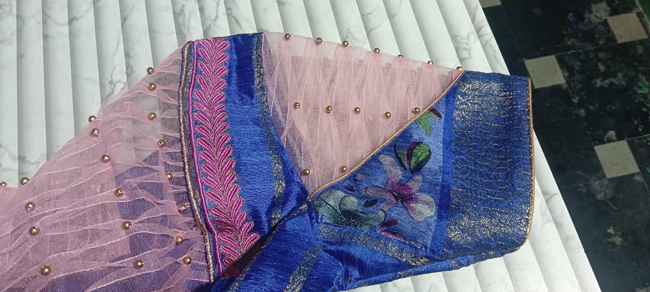 Blue saree with pink blouse, pearl studs and floral embroidery