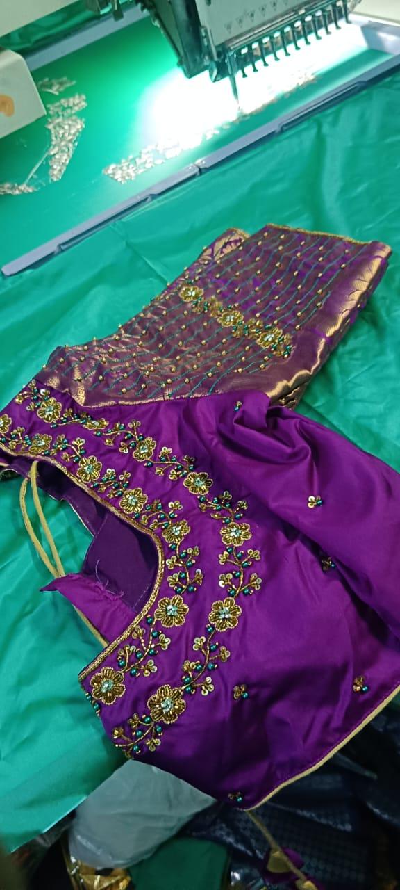 Purple bridal blouse with gold floral maggam work embroidery