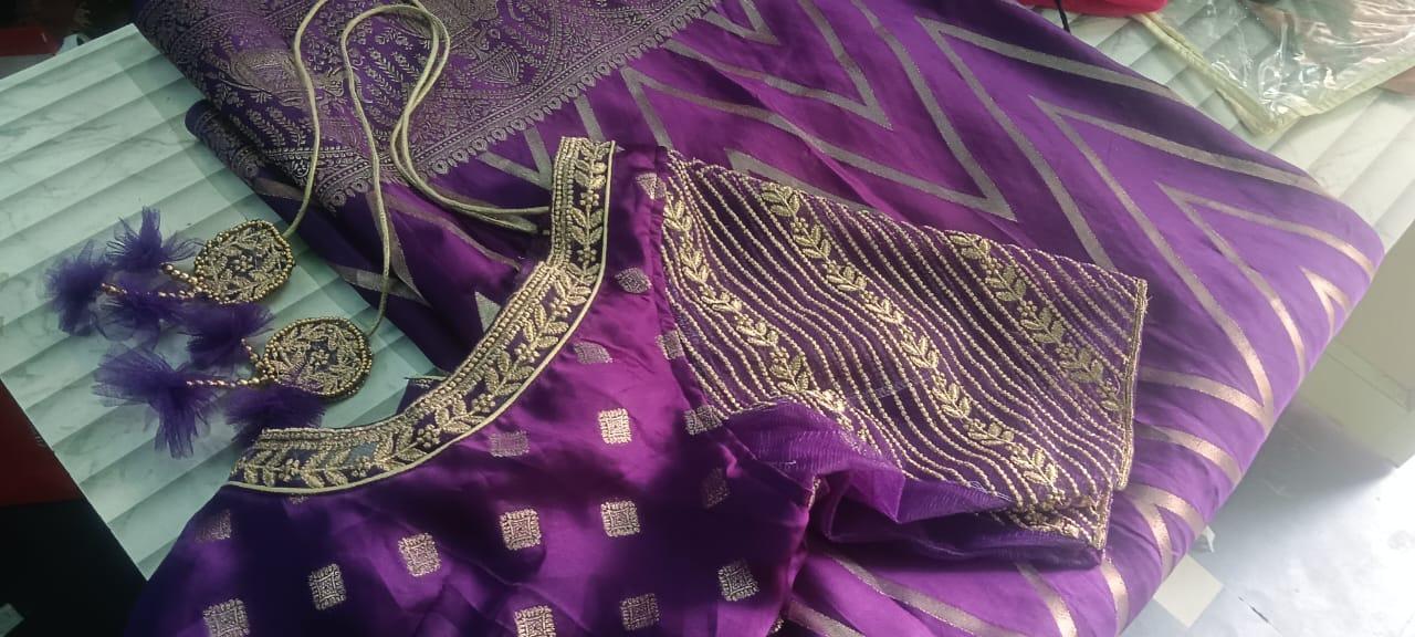 Purple silk saree with gold zari embroidery and matching blouse
