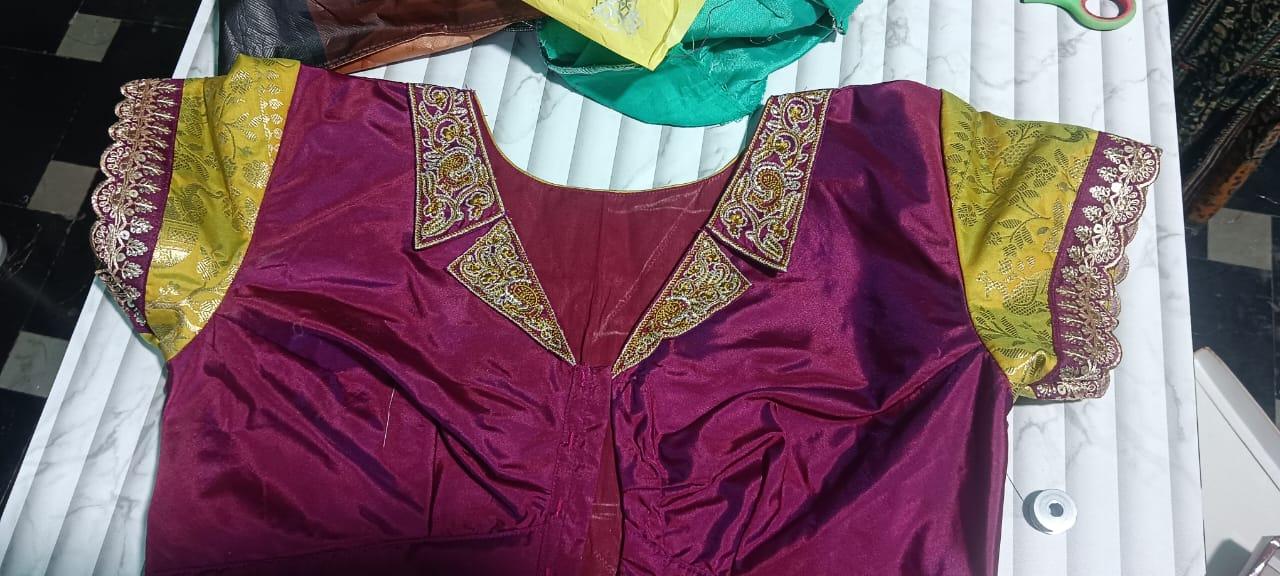 Maroon velvet blouse with golden zari and yellow silk sleeves
