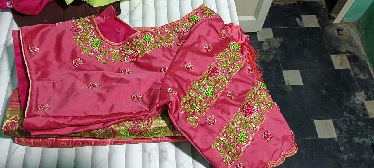 Pink bridal blouse with gold and green zari embroidery work