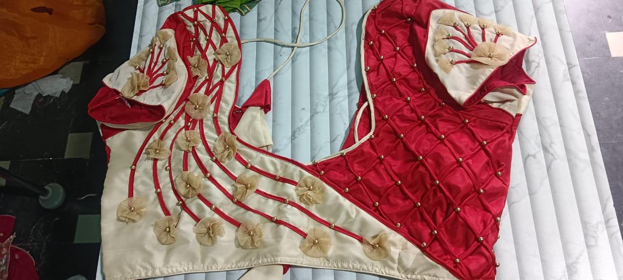Red and cream bridal blouse with gold zari floral embroidery and beadwork