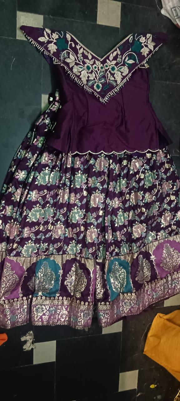 Purple half saree with ornate gold embroidery and floral design