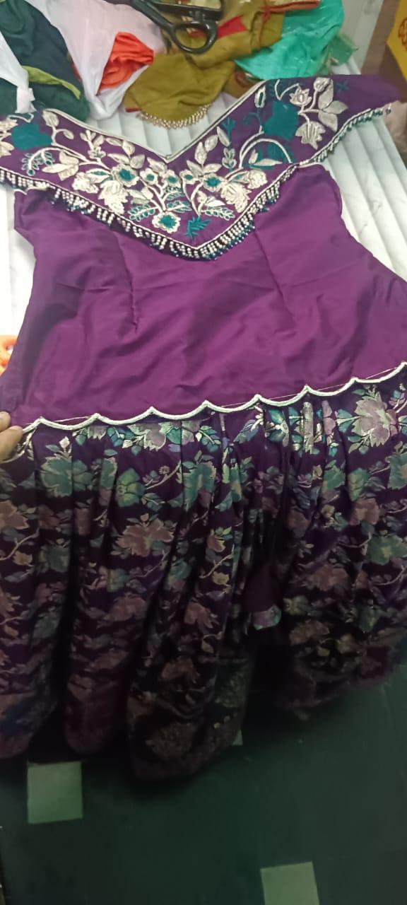 Purple half saree with floral embroidered yoke and patterned skirt