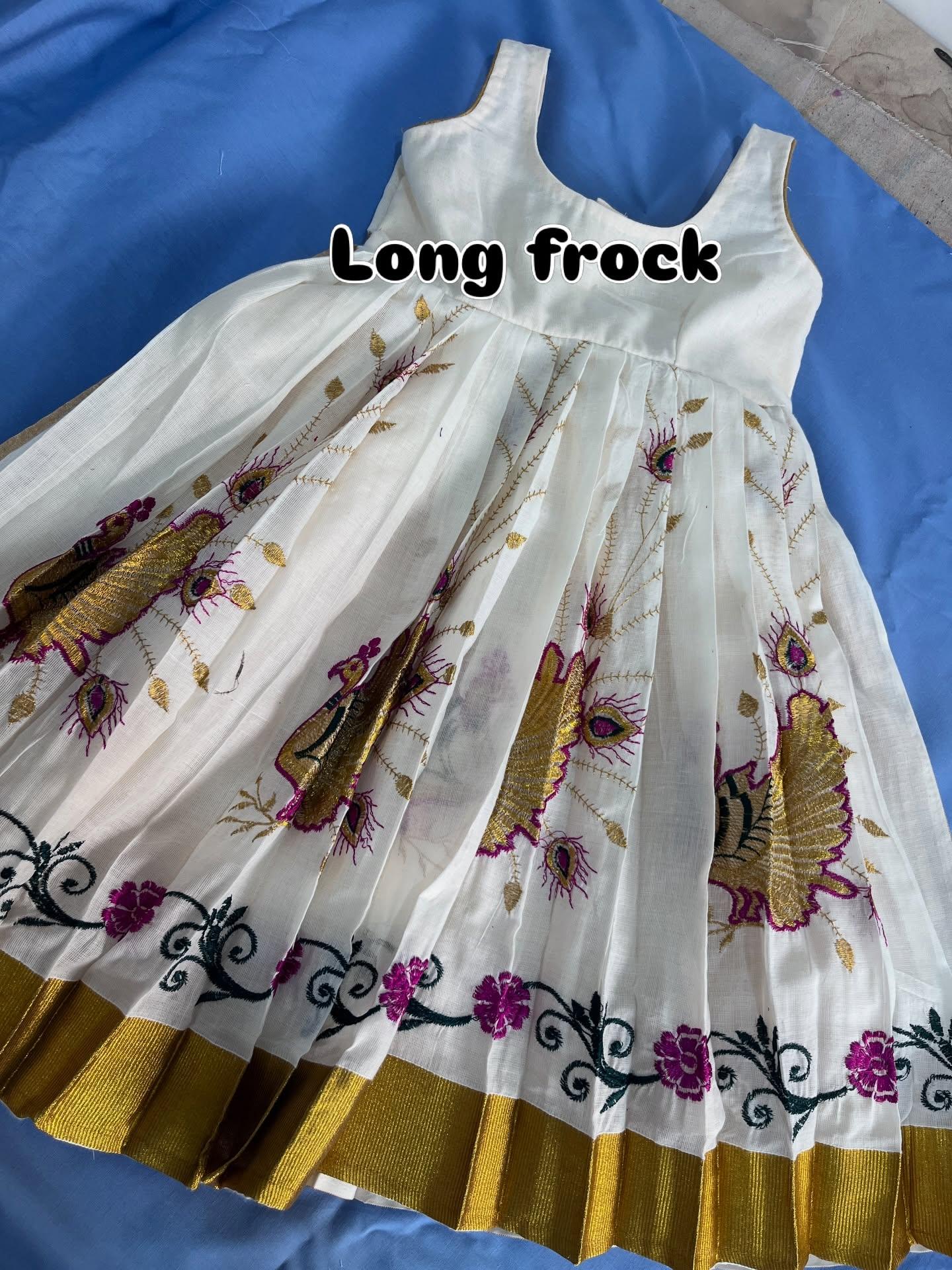 White long frock with purple floral and gold zari embroidery