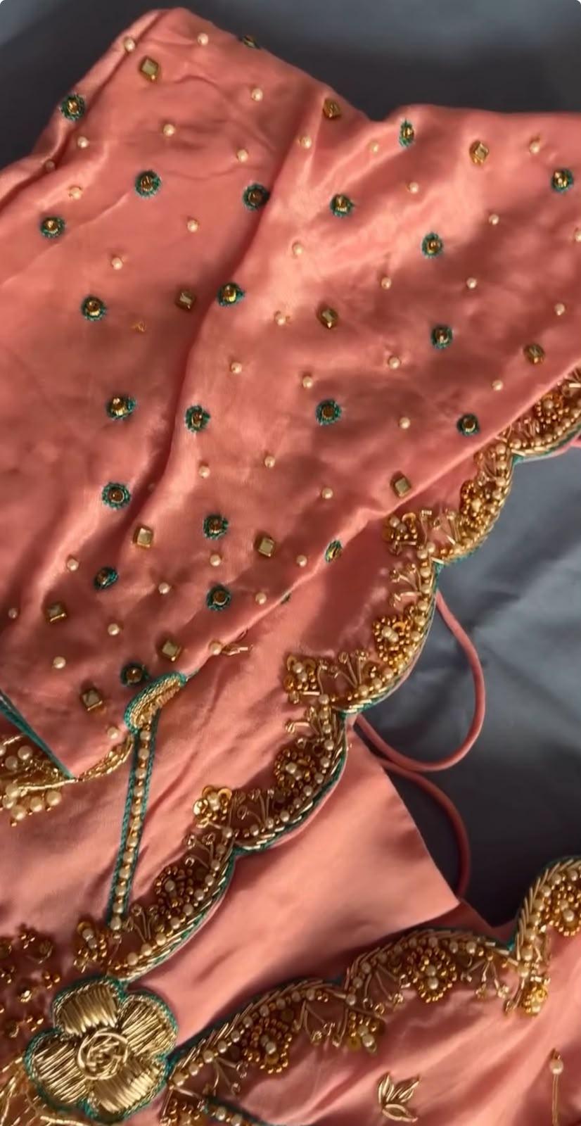 Peach silk blouse with emerald and gold zari embroidery work