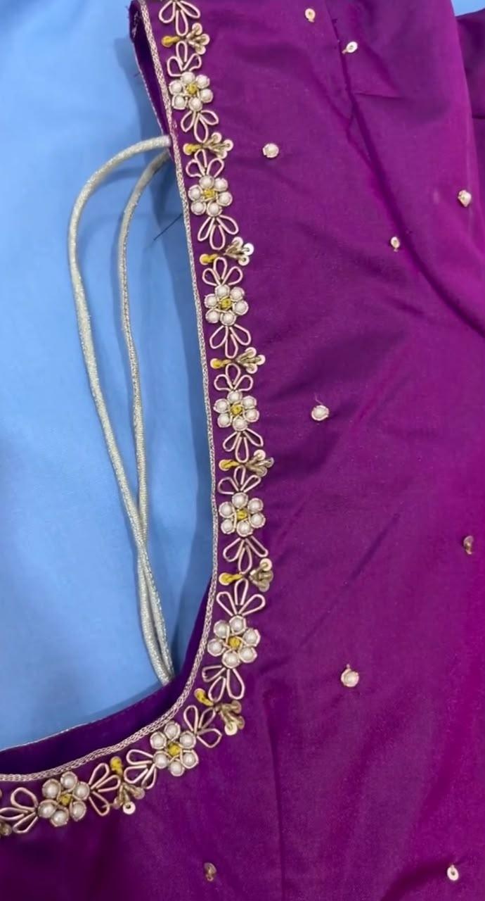 Purple blouse with ornate floral maggam work and pearl embellishments
