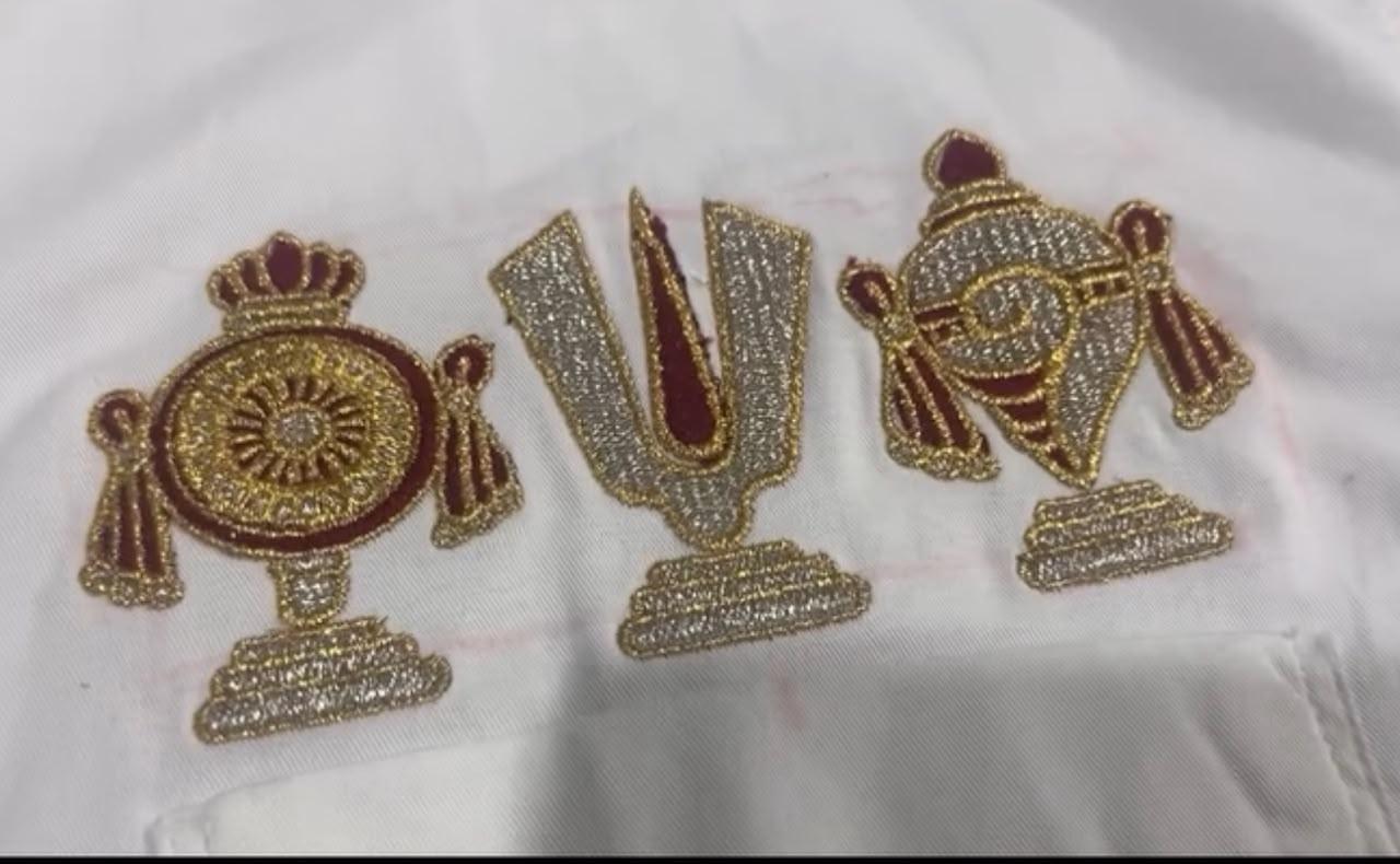 Gold zari embroidered decorative appliques with maroon accents and crown details