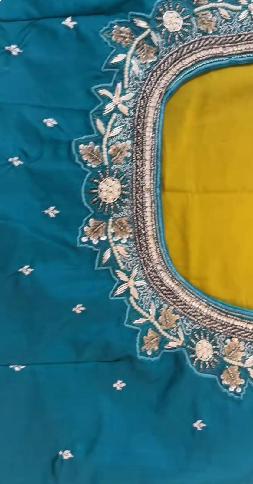 Teal silk blouse with ornate gold zari floral embroidery and yellow interior