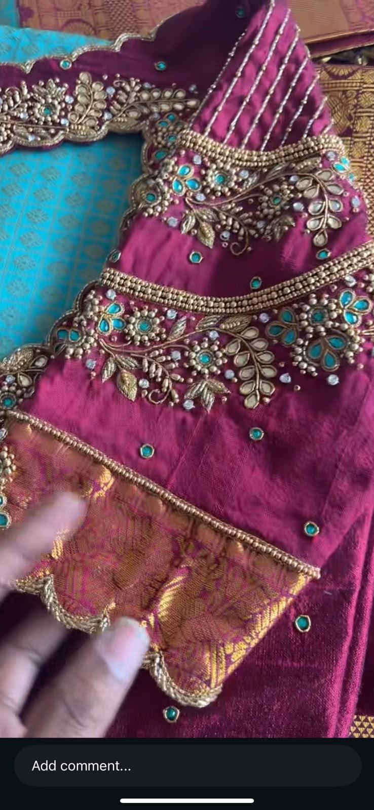 Magenta bridal blouse with intricate maggam work and turquoise stone embellishments