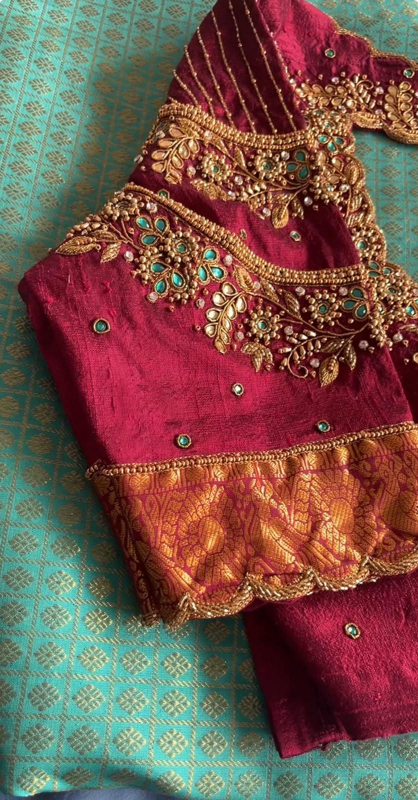 Maroon velvet blouse with intricate gold zari and stone maggam work