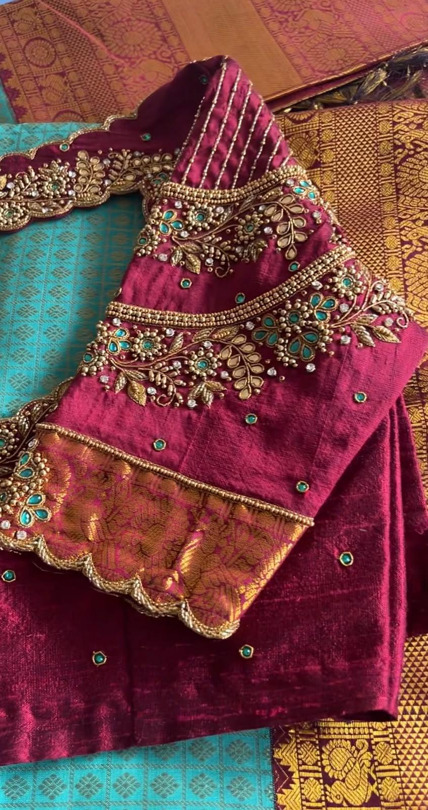 Maroon velvet bridal blouse with gold zari and turquoise stone embroidery