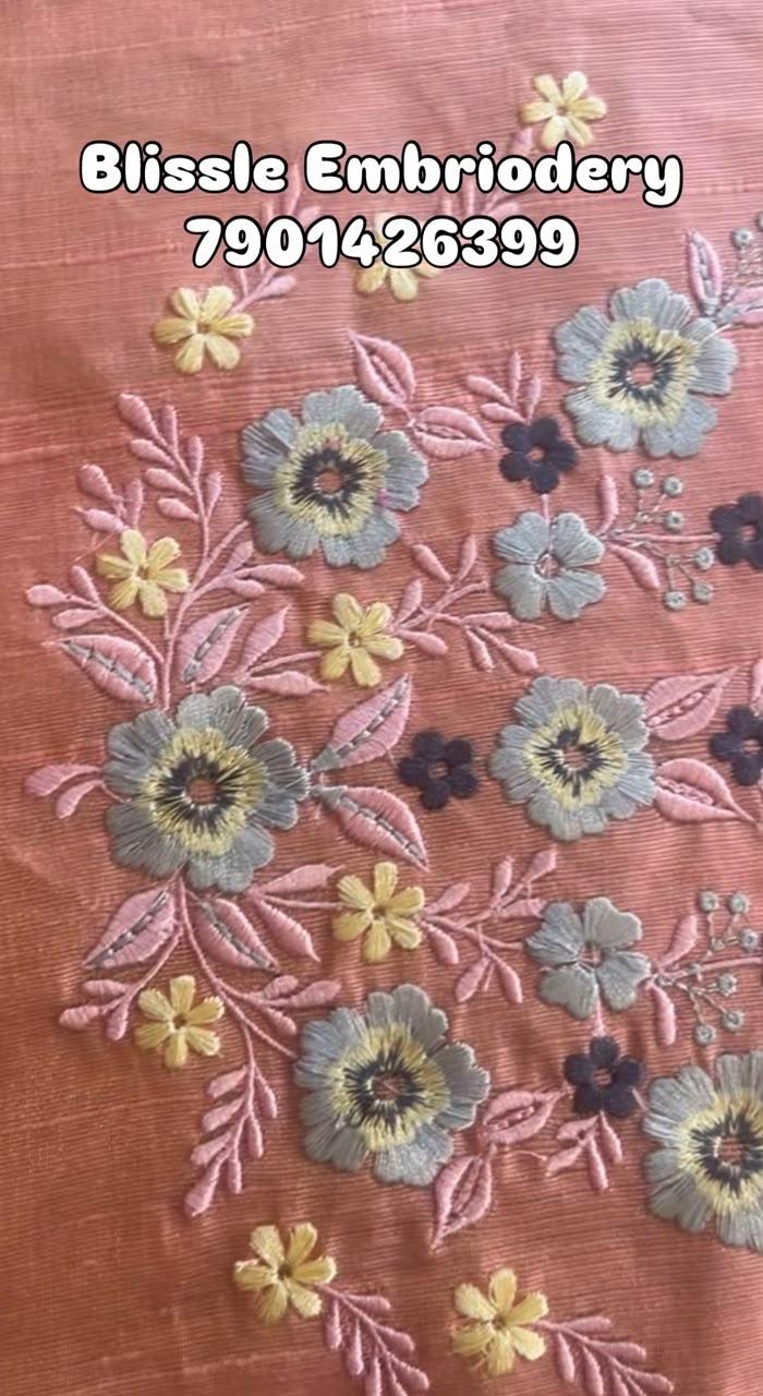 Peach embroidered fabric with floral thread work design