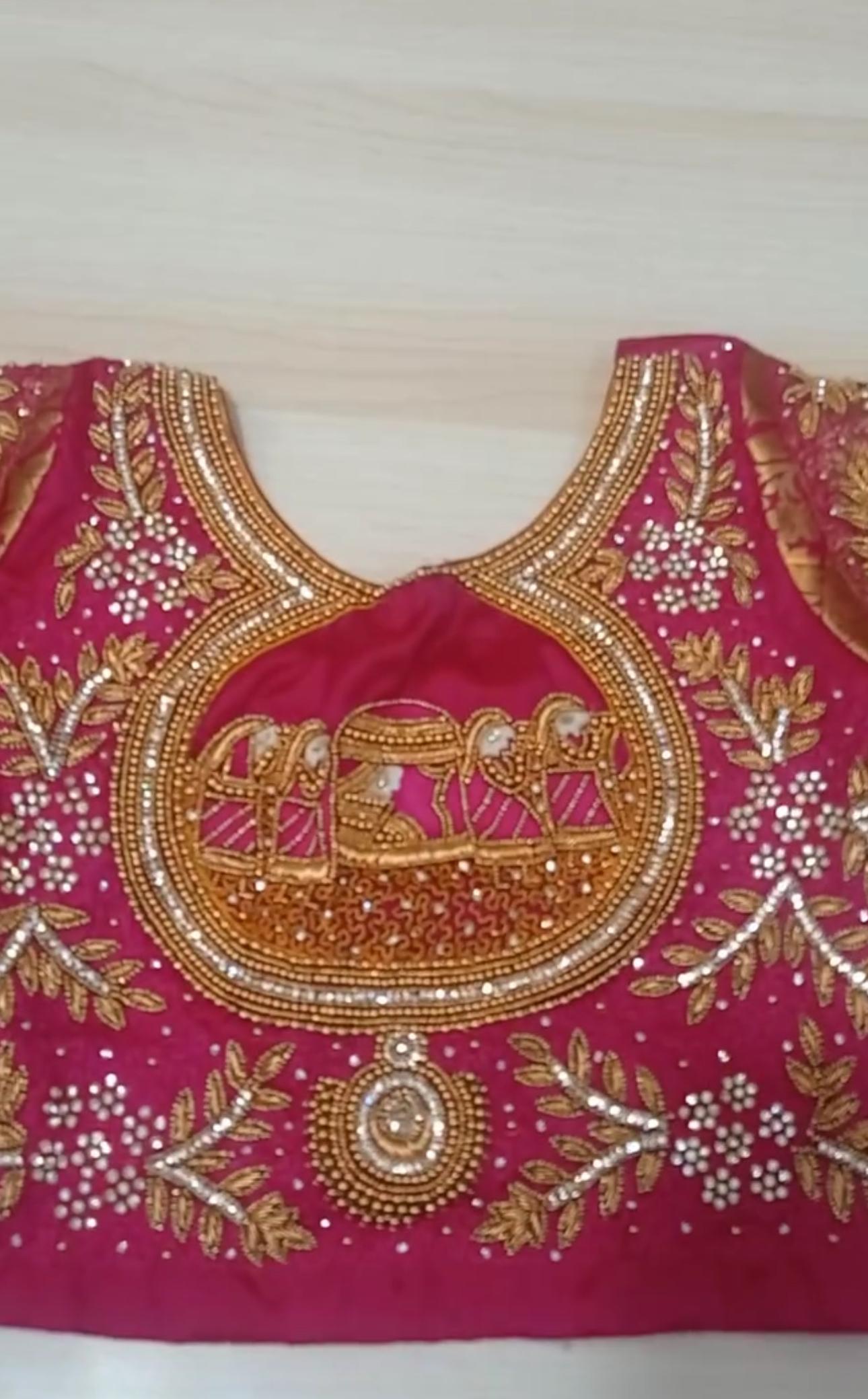 Maroon bridal blouse with gold zari and pearl maggam work embroidery