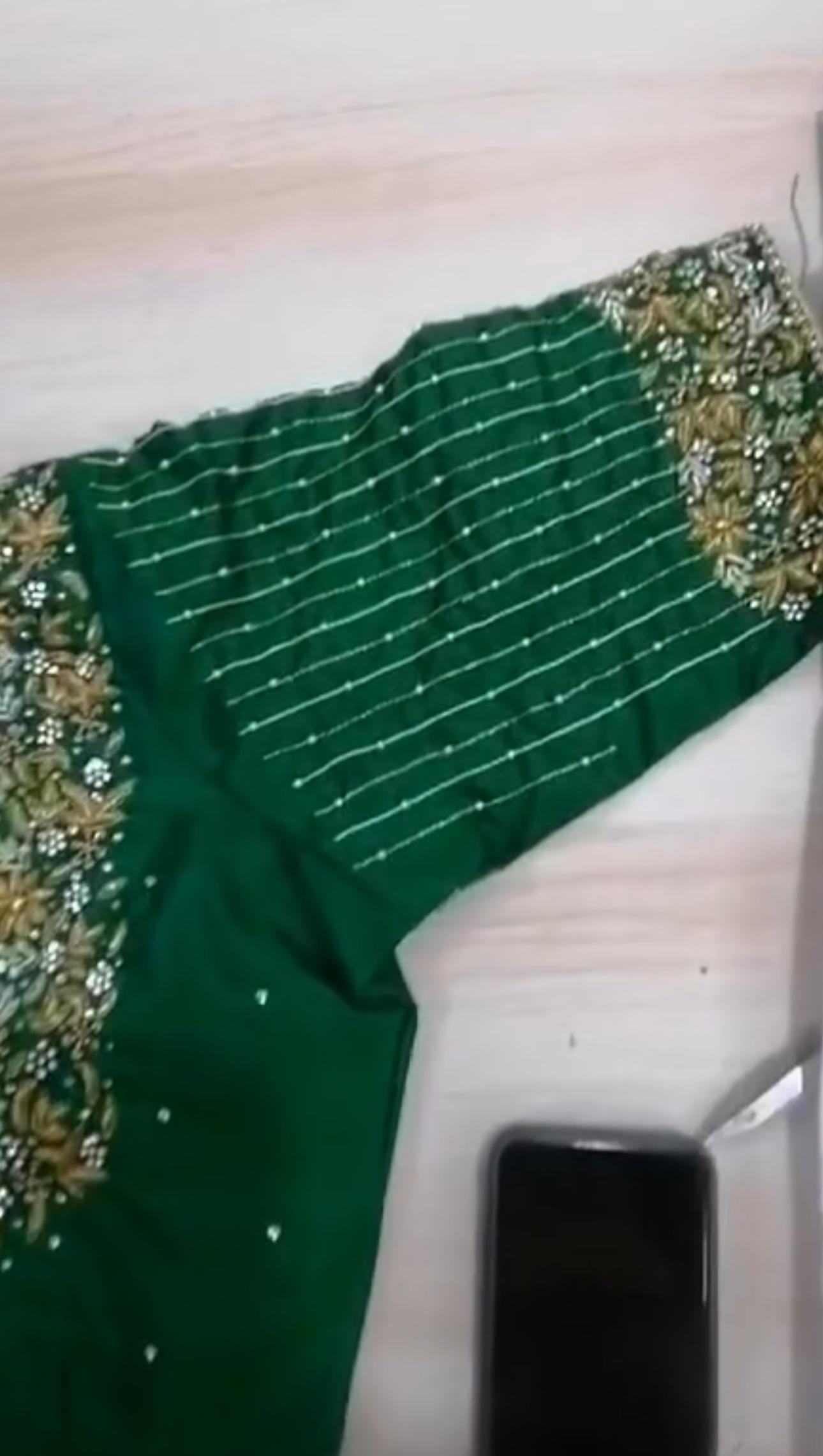 Green silk saree with gold zari border and pearl line embroidery
