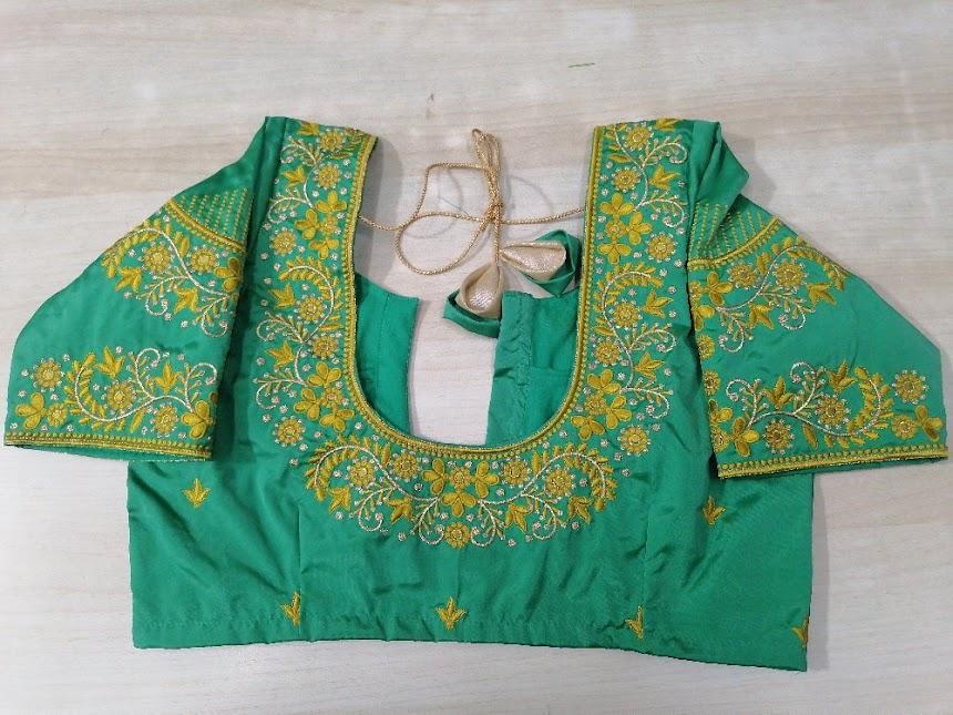 Green designer blouse with gold zari floral embroidery and maggam work