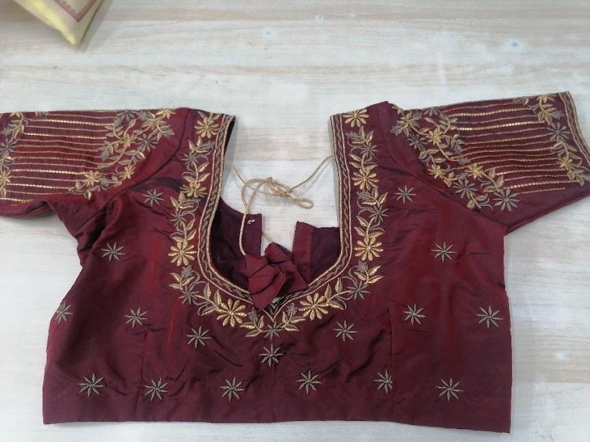 Maroon blouse with gold zari floral embroidery and striped borders